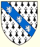 Ermine on a bend azure three lions rampant argent